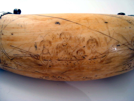 View of scrimshawed whale tooth from historic Darwin voyage. Image courtesy Adam Partridge Auctioneers.